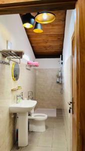 a bathroom with a toilet and a sink at A Luxury Duplex in Dili City, Timor-Leste in Dili