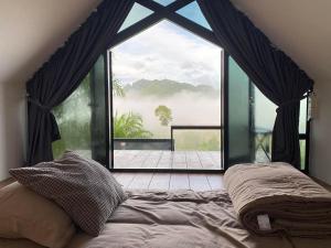 Voodi või voodid majutusasutuse Por Sampao Camp&Resort toas