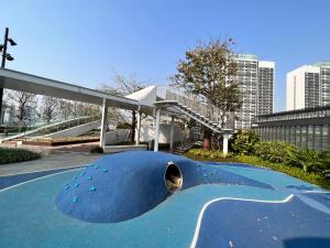 a blue skateboard ramp in the middle of a city at Kezan Condo Hotel in Shenzhen
