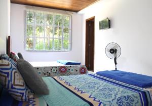 En eller flere senge i et værelse på Finca Hotel Villa Gladys en Mesitas del Colegio