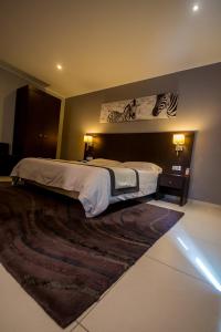 Ein Bett oder Betten in einem Zimmer der Unterkunft Rysara Hotel
