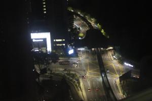 an aerial view of a city street at night at Platinum Suites KLCC at Kualalumpur in Kuala Lumpur