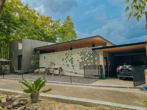 a house with a car parked in front of it at DJipangan Home in Bantul