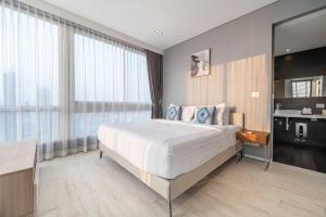Ένα ή περισσότερα κρεβάτια σε δωμάτιο στο Large 3BR Veranda Pattaya Direct Beach Access +29 φωτογραφίες