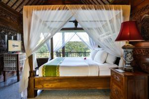 Postel nebo postele na pokoji v ubytování Ayung Resort Ubud