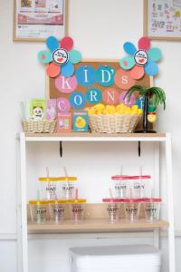 a shelf with cups and a happy birthday sign at Hotel Santa Barbara Miyakojima Resort in Miyako-jima