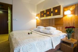 Postel nebo postele na pokoji v ubytování Hotel Zbójnicówka