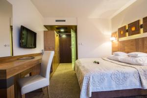 Postel nebo postele na pokoji v ubytování Hotel Zbójnicówka