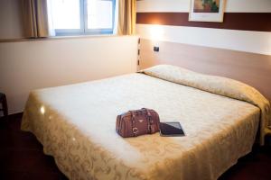 Ένα ή περισσότερα κρεβάτια σε δωμάτιο στο Lizard Hotel