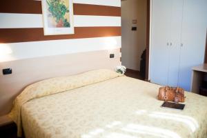 Ένα ή περισσότερα κρεβάτια σε δωμάτιο στο Lizard Hotel