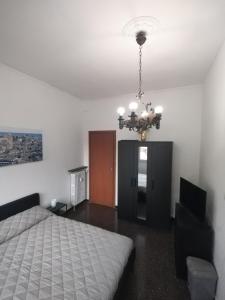 Postel nebo postele na pokoji v ubytování Roby's Rooms affittacamere a Genova, San Martino