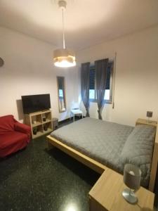 Postel nebo postele na pokoji v ubytování Roby's Rooms affittacamere a Genova, San Martino