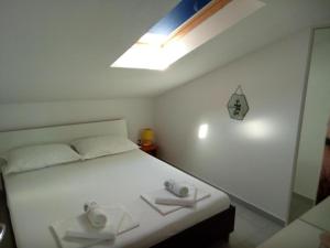 Postel nebo postele na pokoji v ubytování Apartman Sutalo