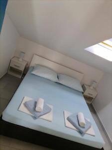 Postel nebo postele na pokoji v ubytování Apartman Sutalo