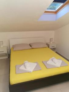 Postel nebo postele na pokoji v ubytování Apartman Sutalo
