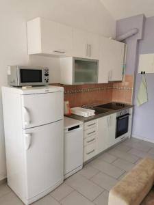 Kuchyň nebo kuchyňský kout v ubytování Apartman Sutalo