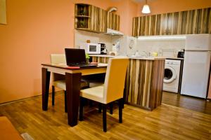 A kitchen or kitchenette at Sunflower Apartment City Center