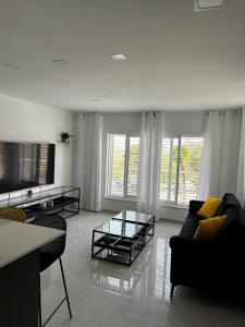 a living room with a couch and a table at מישל נופש ,צופית תחתית 6003 in Eilat +37 photos