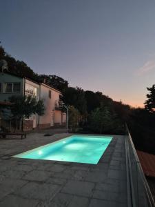 a swimming pool in a yard with a house at Casa sole infinito in Senj