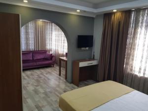 Postel nebo postele na pokoji v ubytování EYFEL HOTEL