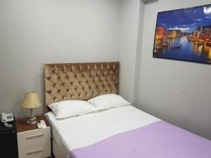 Postel nebo postele na pokoji v ubytování EYFEL HOTEL