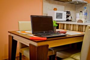 A kitchen or kitchenette at Sunflower Apartment City Center