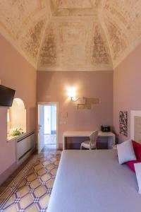 Postel nebo postele na pokoji v ubytování Palazzo Arco Cadura Hotel & Spa + 37 fotografií