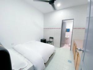 Venice Guest Hostel - Bilik Sahaja客房内的一张或多张床位