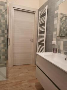 a bathroom with a shower and a sink and a mirror at Casa da Carmine a Tursi in Tursi