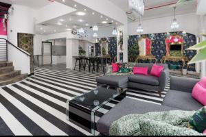 a living room with a couch and a table at Spacious Liverpool Party Pad with 4 Bedrooms! in Liverpool