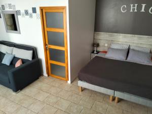 Postel nebo postele na pokoji v ubytování Le Gîte des Marguerites