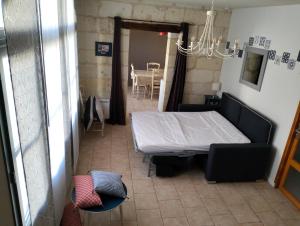 Postel nebo postele na pokoji v ubytování Le Gîte des Marguerites