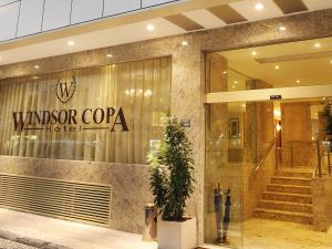 a lobby of a hotel with a sign on the window at Windsor Copa Hotel in Rio de Janeiro