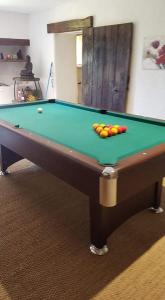 a pool table with balls on top of it at Domaine des grands chênes in Préveranges