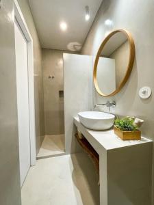 a bathroom with a sink and a mirror at Olivete Apartment in Lisbon