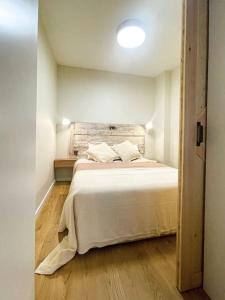 a bedroom with a white bed in a room at Olivete Apartment in Lisbon