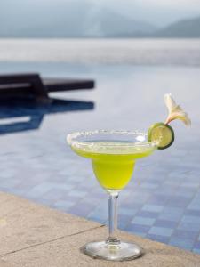 a margarita in a glass with a lime on top at Gili Air Lagoon Resort By Waringin Hospitality in Gili Islands