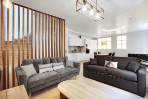 a living room with a couch and a table at Pick A Flat's Apartment in La Chapelle - Impasse du Curé in Paris