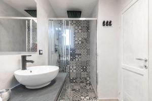 a bathroom with a sink and a shower at Villa Esmeralda - Free Wifi - with swimming pool in Costa Paradiso