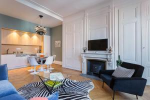a living room with a couch and a fireplace at Confort - T3 rental - Lyon 2 in Lyon