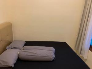 Säng eller sängar i ett rum på First Tasnim Village