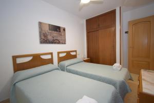 Postel nebo postele na pokoji v ubytování La Pinta - Fincas Arena + 32 fotografií