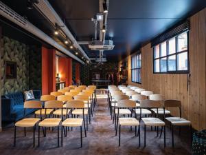 a row of stools in a waiting room at MOB HOTEL Paris Les Puces in Saint-Ouen