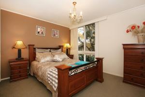 Кровать или кровати в номере Wattle Holiday Rental