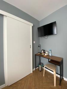 a room with a desk and a chair next to a door at Willa K52 in Siemiatycze