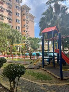 a playground in a park with a slide at D Nish Homestay in Tawau