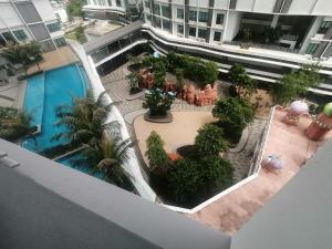 an overhead view of a courtyard with a swimming pool at [SLEEPS 4 PAX] @ I-CITY in Shah Alam