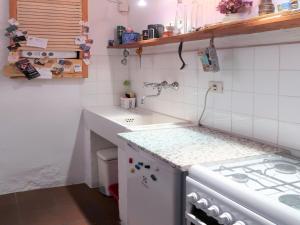 a small kitchen with a sink and a stove at Holiday Home Danese by Interhome in Civezza +11 photos