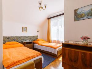 a hotel room with two beds and a window at Holiday Home Iris by Interhome in Fonyód