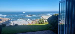 a view of the ocean from a balcony of a house at Emmaus-On-Sea in Yzerfontein